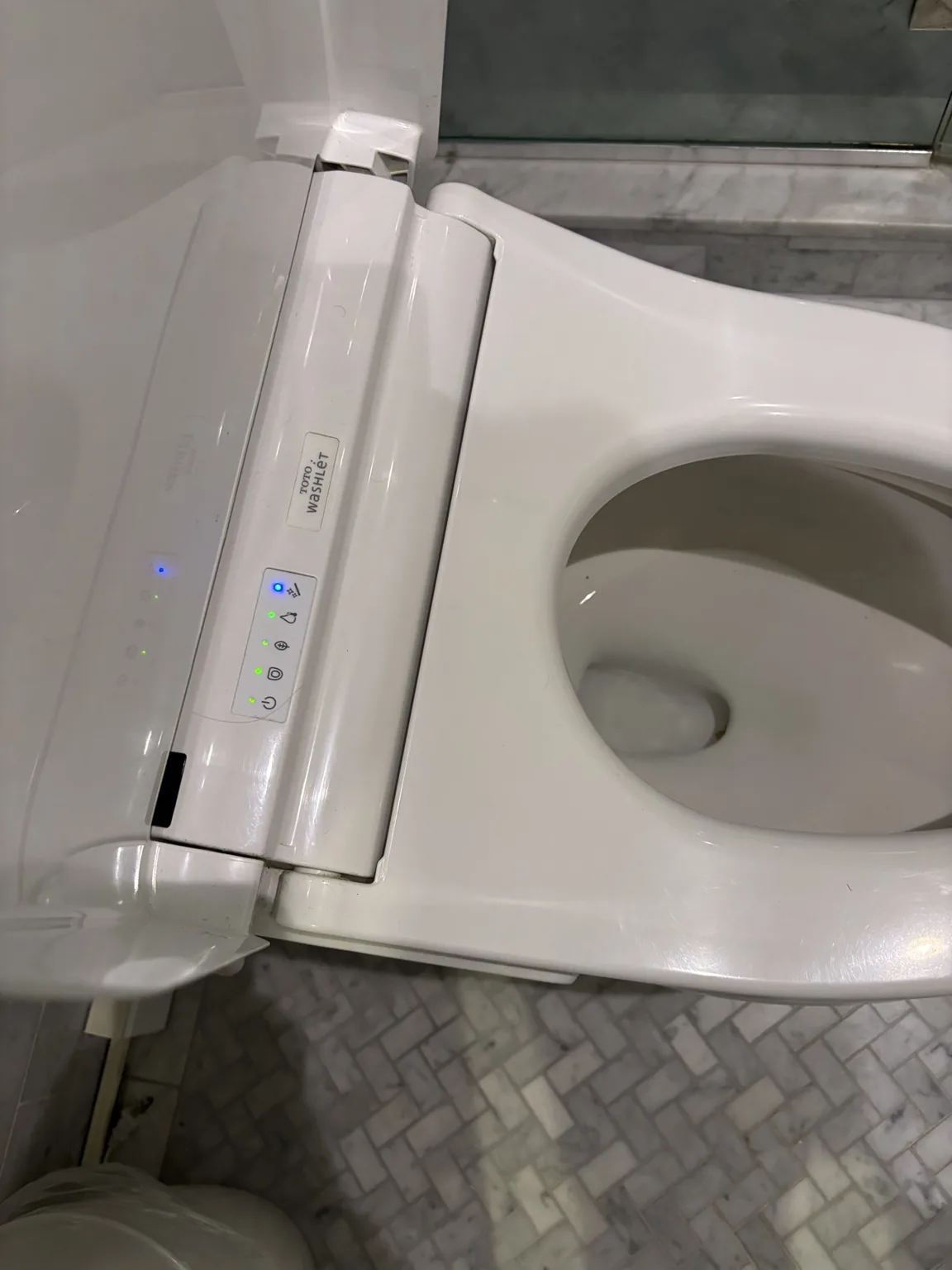 Close-up of TOTO C5 Washlet fit on an elongated toilet